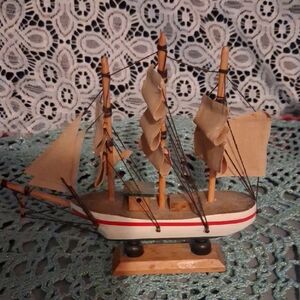 Wooden Model Sailboat with Tan Sails